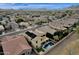 Lovely aerial view of home with backyard pool and mountain views at 3238 W White Canyon Rd, San Tan Valley, AZ 85144