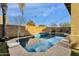 Beautiful backyard pool features a basketball hoop and a tanning shelf at 3238 W White Canyon Rd, San Tan Valley, AZ 85144