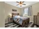 Bedroom featuring a custom wood-look bed frame, wood-look floors, and a large window at 3238 W White Canyon Rd, San Tan Valley, AZ 85144