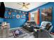 Bright, blue-themed bedroom, with a ceiling fan and comfortable seating at 3238 W White Canyon Rd, San Tan Valley, AZ 85144