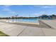 Large community pool featuring a splash pad area with playful water features on a sunny day at 3238 W White Canyon Rd, San Tan Valley, AZ 85144