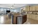 Kitchen with an island, stainless steel appliances, light-colored cabinets, and an open layout at 3238 W White Canyon Rd, San Tan Valley, AZ 85144