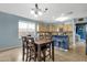 Eat-in kitchen featuring a dark wood table, light countertops, and light blue walls at 3238 W White Canyon Rd, San Tan Valley, AZ 85144