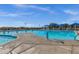 This large swimming pool features marked lanes and shaded seating areas for residents' enjoyment at 3238 W White Canyon Rd, San Tan Valley, AZ 85144