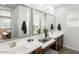 Elegant bathroom featuring double sinks, modern fixtures, and a spacious vanity area at 3255 E Baler Dr, San Tan Valley, AZ 85140