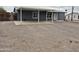 Single-story home with covered parking and a gravel driveway in a rural community at 329 N 83Rd Pl, Mesa, AZ 85207