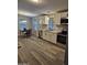 Bright eat-in kitchen featuring modern cabinetry, stainless appliances and gray countertops at 329 N 83Rd Pl, Mesa, AZ 85207