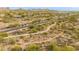 Bird's eye view highlighting a desert home near a walking path, set against a mountain backdrop and desert landscape at 33389 N 71St St, Scottsdale, AZ 85262