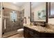 Beautiful bathroom features a granite countertop, a glass enclosed shower with a rainfall showerhead at 33389 N 71St St, Scottsdale, AZ 85262