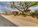 Beautiful home exterior with well-manicured desert landscaping and a two-car garage at 33389 N 71St St, Scottsdale, AZ 85262