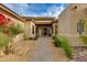 Charming front patio with desert landscaping and a welcoming entrance at 33389 N 71St St, Scottsdale, AZ 85262