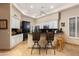 Kitchen with granite counters, bar seating, white cabinets and stainless appliances at 33389 N 71St St, Scottsdale, AZ 85262