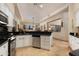 Kitchen with stainless steel appliances, granite countertops, and white cabinetry at 33389 N 71St St, Scottsdale, AZ 85262