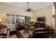 Bright and airy living room with large windows and elegant leather seating at 33389 N 71St St, Scottsdale, AZ 85262