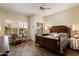 Comfortable main bedroom with hardwood flooring and bright shuttered windows at 33389 N 71St St, Scottsdale, AZ 85262