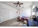 Bedroom featuring a ceiling fan and a closet that provides extra storage solutions at 3482 N 300Th Dr, Buckeye, AZ 85396