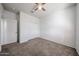 Bedroom with carpet, ceiling fan, and a closet with sliding doors to save space at 3482 N 300Th Dr, Buckeye, AZ 85396