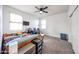 Bedroom with a ceiling fan, carpeted flooring, and two windows for natural lighting at 3482 N 300Th Dr, Buckeye, AZ 85396