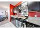 Well-appointed kitchen with stainless steel range hood and stove, granite countertops, and sleek cabinets at 3482 N 300Th Dr, Buckeye, AZ 85396