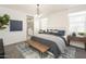 Serene main bedroom showcases a plush bed, stylish furnishings, and calming decor, creating a relaxing retreat at 37995 N Stillmeadow Rd, San Tan Valley, AZ 85140