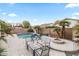 Entertaining backyard with a patio, fire pit, outdoor seating and grill perfect for entertaining in this single Gathering home at 4272 E Ivanhoe St, Gilbert, AZ 85295