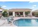 Inviting backyard pool with a spa, lounge chairs and outdoor seating with a covered patio of this single Gathering home at 4272 E Ivanhoe St, Gilbert, AZ 85295