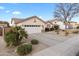 Beautiful home with a large driveway, two car garage, and mature trees in the front yard at 4272 E Ivanhoe St, Gilbert, AZ 85295