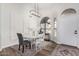 Bright dining room features a modern chandelier, decorative rug, and stylish white table and chairs at 441 S Dodge Dr, Chandler, AZ 85225