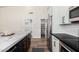 Bright kitchen with stainless steel appliances, marble countertops, and ample cabinet space for an organized cooking area at 441 S Dodge Dr, Chandler, AZ 85225