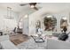 Open-concept living room featuring large windows and a neutral color palette offers a bright and airy atmosphere at 441 S Dodge Dr, Chandler, AZ 85225