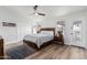 Cozy main bedroom features a ceiling fan, wood-look floors, and a neutral color palette at 441 S Dodge Dr, Chandler, AZ 85225