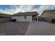 Home featuring a low maintenance gravel backyard and a paved patio at 4517 N 123Rd Dr, Avondale, AZ 85392