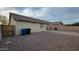 The backyard is gravel-filled and has a paved walkway to a side gate at 4517 N 123Rd Dr, Avondale, AZ 85392