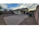 Home showcasing a paved patio and low maintenance gravel backyard at 4517 N 123Rd Dr, Avondale, AZ 85392