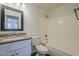 Bathroom boasting a tub, and vanity with granite counters, and white cabinets at 4517 N 123Rd Dr, Avondale, AZ 85392