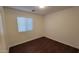 A simple bedroom featuring hardwood floors and a window with coverings at 4517 N 123Rd Dr, Avondale, AZ 85392