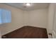 A simple bedroom featuring hardwood floors and a window with coverings at 4517 N 123Rd Dr, Avondale, AZ 85392