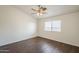 Bedroom with a ceiling fan and light fixture and natural light from the window at 4517 N 123Rd Dr, Avondale, AZ 85392