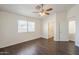 Bedroom with a ceiling fan and light fixture and natural light from the window at 4517 N 123Rd Dr, Avondale, AZ 85392