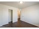 Bedroom with a closet with sliding doors and access to another room at 4517 N 123Rd Dr, Avondale, AZ 85392