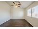 Bedroom with a ceiling fan and light fixture and natural light from the window at 4517 N 123Rd Dr, Avondale, AZ 85392