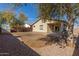 View of the backyard with a covered patio and ample space for outdoor activities at 45341 W Paraiso Ln, Maricopa, AZ 85139