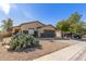 Charming single-story home with desert landscaping and a two-car garage at 45341 W Paraiso Ln, Maricopa, AZ 85139