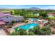 Aerial view of multiple pools, lounge areas, and lush landscaping throughout the community at 4627 E Sourwood Dr, Gilbert, AZ 85298