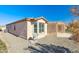 A well-maintained home exterior shows a tidy yard and inviting backyard patio area at 4627 E Sourwood Dr, Gilbert, AZ 85298