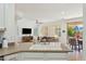 Open-concept kitchen with granite countertops, white cabinetry, and view of the living room at 4627 E Sourwood Dr, Gilbert, AZ 85298