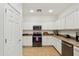 Bright kitchen with stainless steel appliances, granite countertops, and ample white cabinets at 4627 E Sourwood Dr, Gilbert, AZ 85298