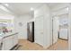 Spacious kitchen seamlessly transitions to the laundry room, featuring modern appliances and ample counter space at 4627 E Sourwood Dr, Gilbert, AZ 85298