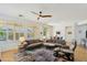 Living area filled with natural light, ceiling fan and a glimpse of the kitchen at 4627 E Sourwood Dr, Gilbert, AZ 85298