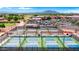 Overhead view of multiple pickleball courts at a community sports facility with mountain views at 4627 E Sourwood Dr, Gilbert, AZ 85298